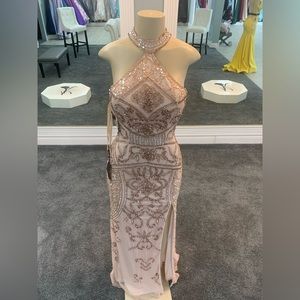 size 2 High neck halter top. Mid slit. Keyhole back. Heavy jeweling. Light rose